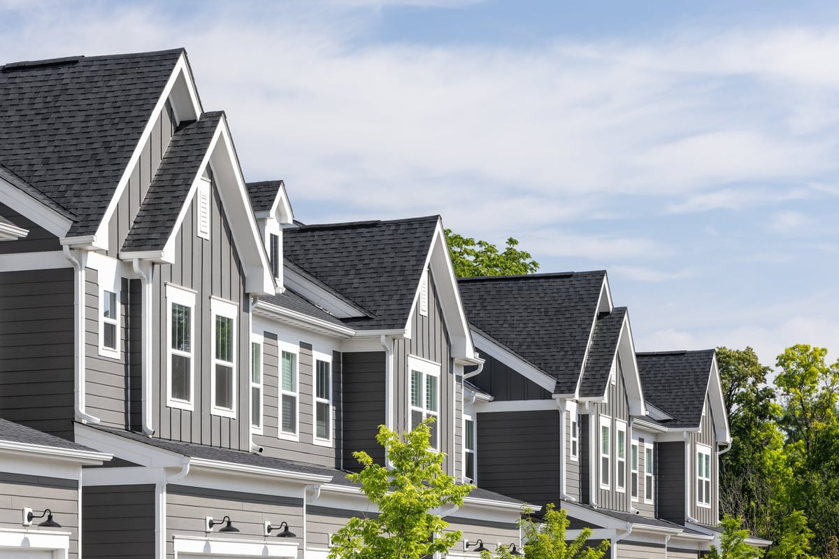 Detail of modern townhomes with grey and white siding